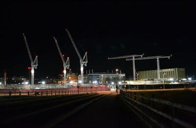 Lights during construction, early evening, AstraZeneca and Papworth sites from the busway bridge, 20 December 2015.