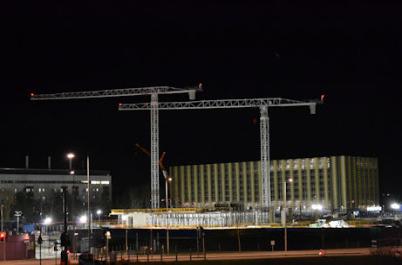 Lights during construction, early evening, Papworth site from the busway bridge, 20 December 2015.