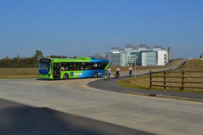 Bus turning from the Guided Busway bridge. Photo: Andrew Roberts, 3 October 2011.
