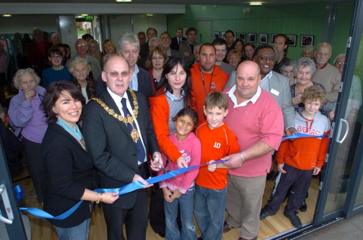 Cutting the ribbon at the opening of the Pavilion, 14 November 2009: Councillor Sheila Stuart (Deputy Mayor), Councillor Russ McPherson (Mayor), Roger Randall (Pavilion Manager), Cathryn Raffan and Lewis Owen (ChYpPS), Graham Bass (Chair, Trumpington Residents’ Association), Councillor Salah al Bander and many of the participants in the background, with Shanice Newman, Owen Bass and Samuel Paynton in foreground, at the opening of the Pavilion, 14 November 2009. Photo: Cambridge News (CIT0610773)