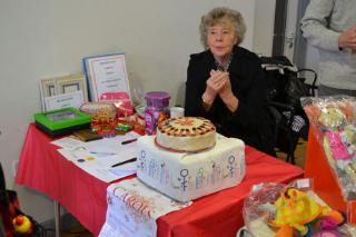 Jean Stevens at the Trumpington Labour Group stall with a cake being raffled, TRA Christmas Fair at Trumpington Pavilion, 1 December 2012.