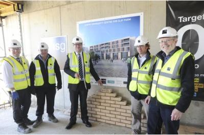 Construction ceremony at the Clay Farm Centre: Steven Ponting, project manager; Andy Ellis, construction manager; Councillor Richard Johnson; Joerg Poeschus, architect; and Councillor Richard Patterson. Photo: Richard Patterson, Cambridge News, 20 October 2015.