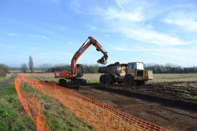 Clearing top soil from the field behind Foster Road prior to archaeological work. Photo: Andrew Roberts, 24 February 2011.