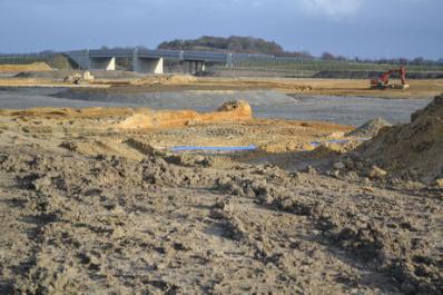Looking from the track from the allotments to the railway, with construction underway for the largest pond, with Addenbrooke’s Road bridge in the distance. Photo: Andrew Roberts, 10 March 2011.