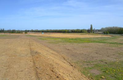 Looking north across the Clay Farm fields and the archaeological excavation, from the topsoil heap to the rear of Foster Road, 10 April 2011.