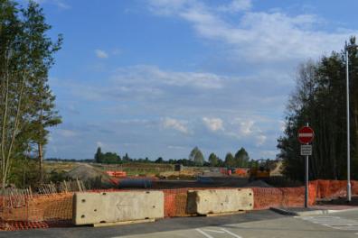 Looking east along the line of the Clay Farm spine road from the new junction with the Busway. Photo: Andrew Roberts, 22 July 2011.