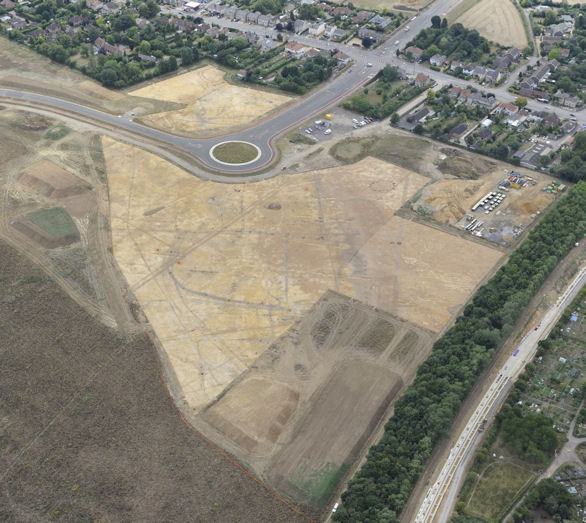 Aerial view of the archaeological investigations of the Abode area, to the east of Shelford Road (top), with the Addenbrooke’s Road roundabout and work on the Guided Busway in the old railway cutting (right), July-August 2010. Source: Oxford Archaeology East.