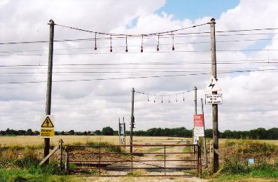 The railway crossing on the track from the allotments towards Addenbrooke’s Hospital, looking west across Clay Farm. Photo: Andrew Roberts, August 2007.