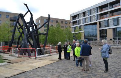 ) Local residents looking around the 'Bronze House' sculpture in Hobson Square, immediately after its construction. Photo: Andrew Roberts, 5 May 2017.