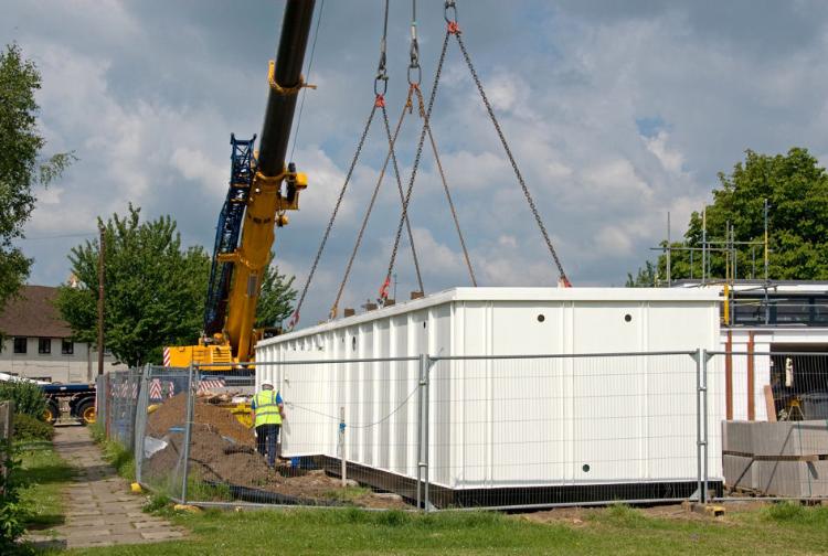 Positioning the changing rooms on their base. Photo: Stephen Brown, May 2009.
