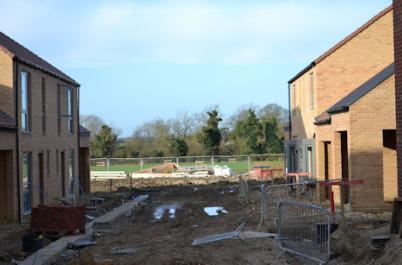 Progress with homes in Otter Close, looking onto the country park, Trumpington Meadows, 20 December 2015.