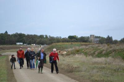 Participants during an art walk around Trumpington Meadows, with the church in the background. Photo: Andrew Roberts, 9 October 2011.