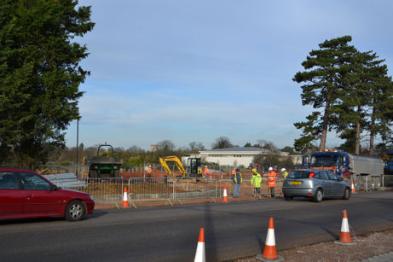 Construction work on the Trumpington Meadows access road from the Hauxton Road junction with the church tower and Waitrose in the background. Photo: Andrew Roberts, 24 November 2011.