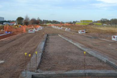 Construction work on the Trumpington Meadows access road from the Hauxton Road junction with the John Lewis building to the left. Photo: Andrew Roberts, 24 November 2011.