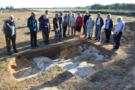 Local residents looking at one of the Late Saxon/Early Medieval sunken structures, Trumpington Meadows archaeological site. Photo: Andrew Roberts, 24 May 2011.