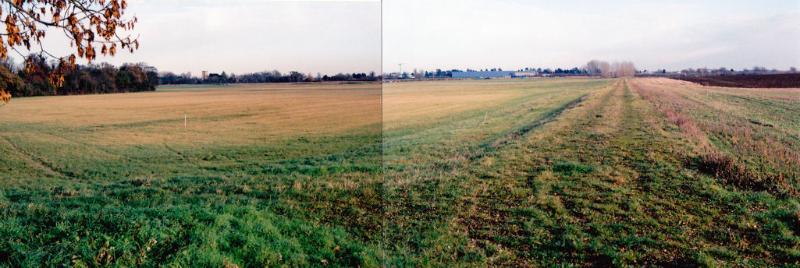 Panorama looking north east across the Trumpington Meadows parkland from Byron’s Pool, with the trees of Byron’s Pool and the Parish Church to the left, the John Lewis building and old railway line. Photo: Andrew Roberts, 9 December 2010.